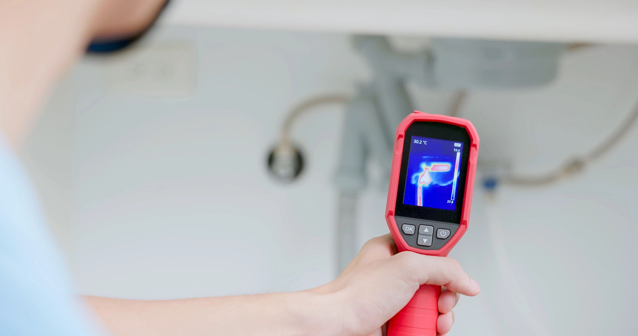 Technician performing leak detection